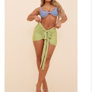 Green tie front mini skirt
